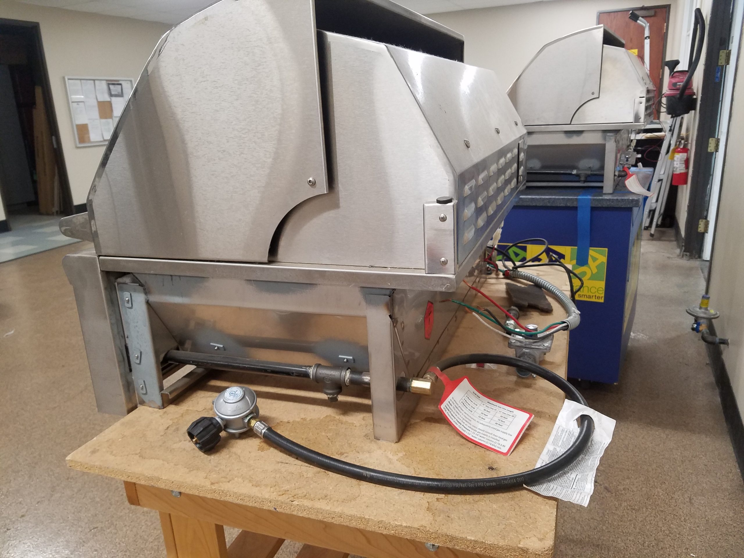 Grill on a workbench being serviced